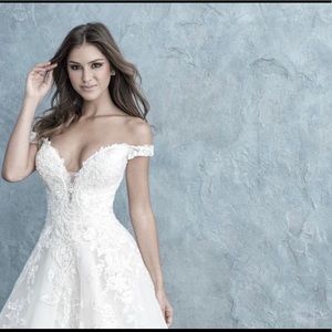 Elegant ballgown embodies romantic featuring off-shoulder sleeves an lace galore